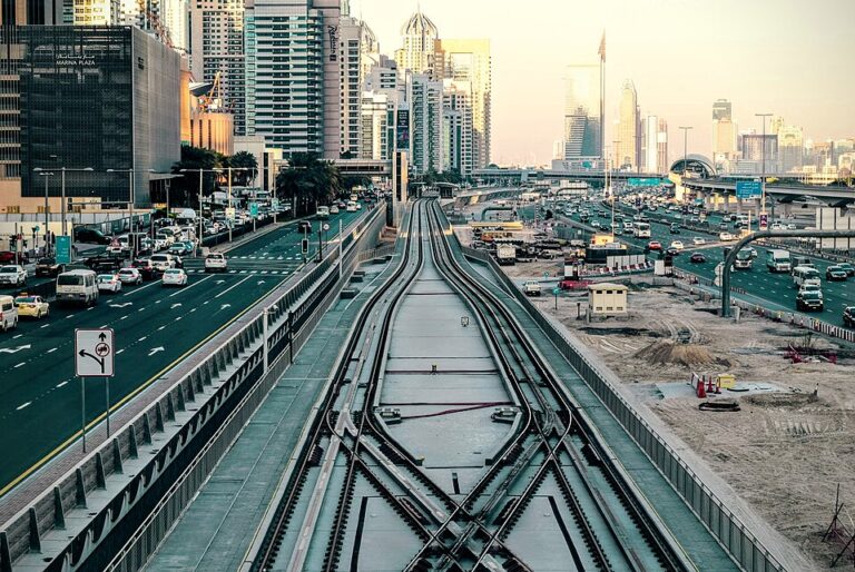 Downtown Dubai skyline view with Sheikh Zayed Road traffic and Metro tracks
